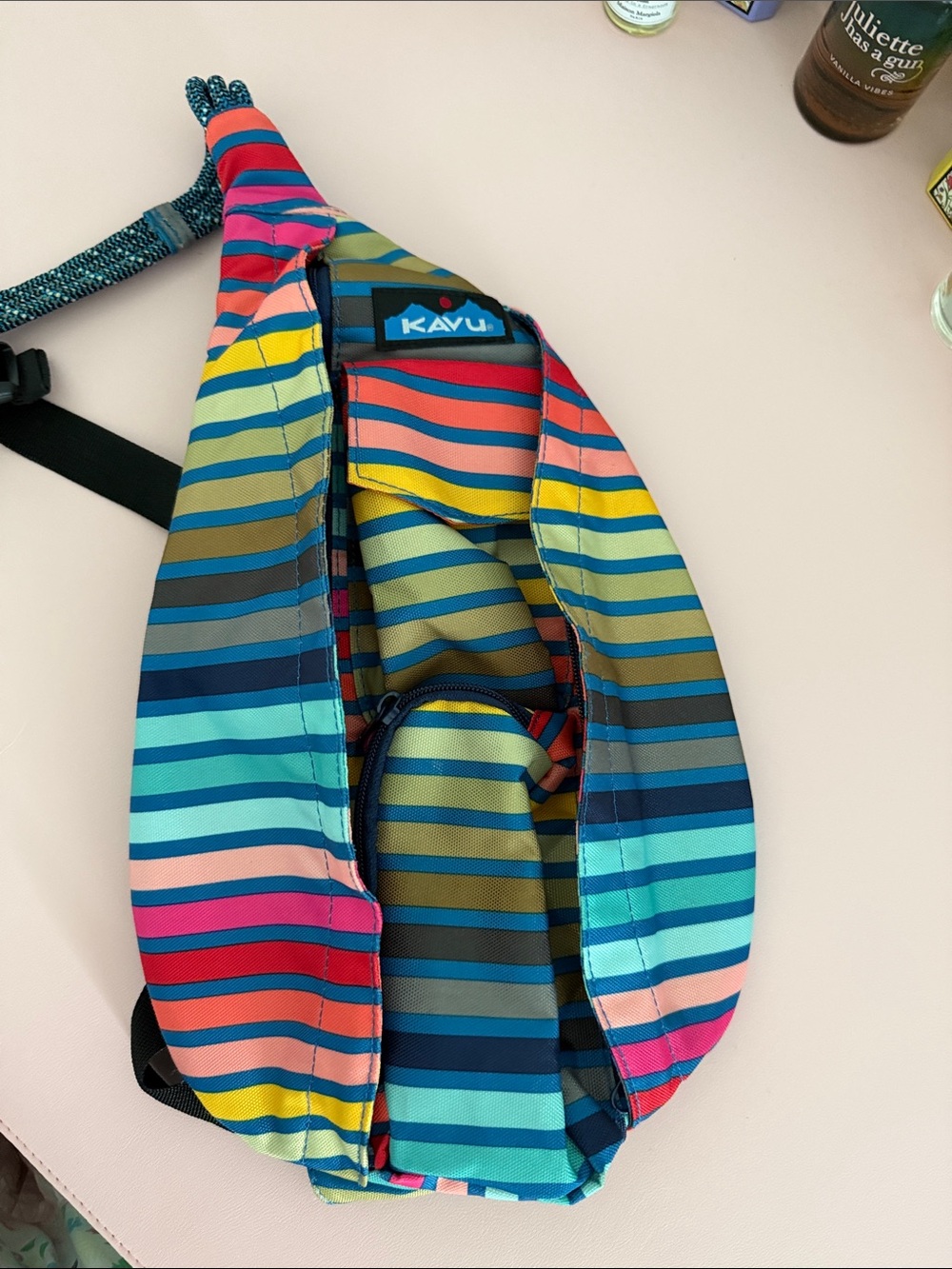 Kavu Striped Sling Pack in Blue, Pink, Yellow & Tan